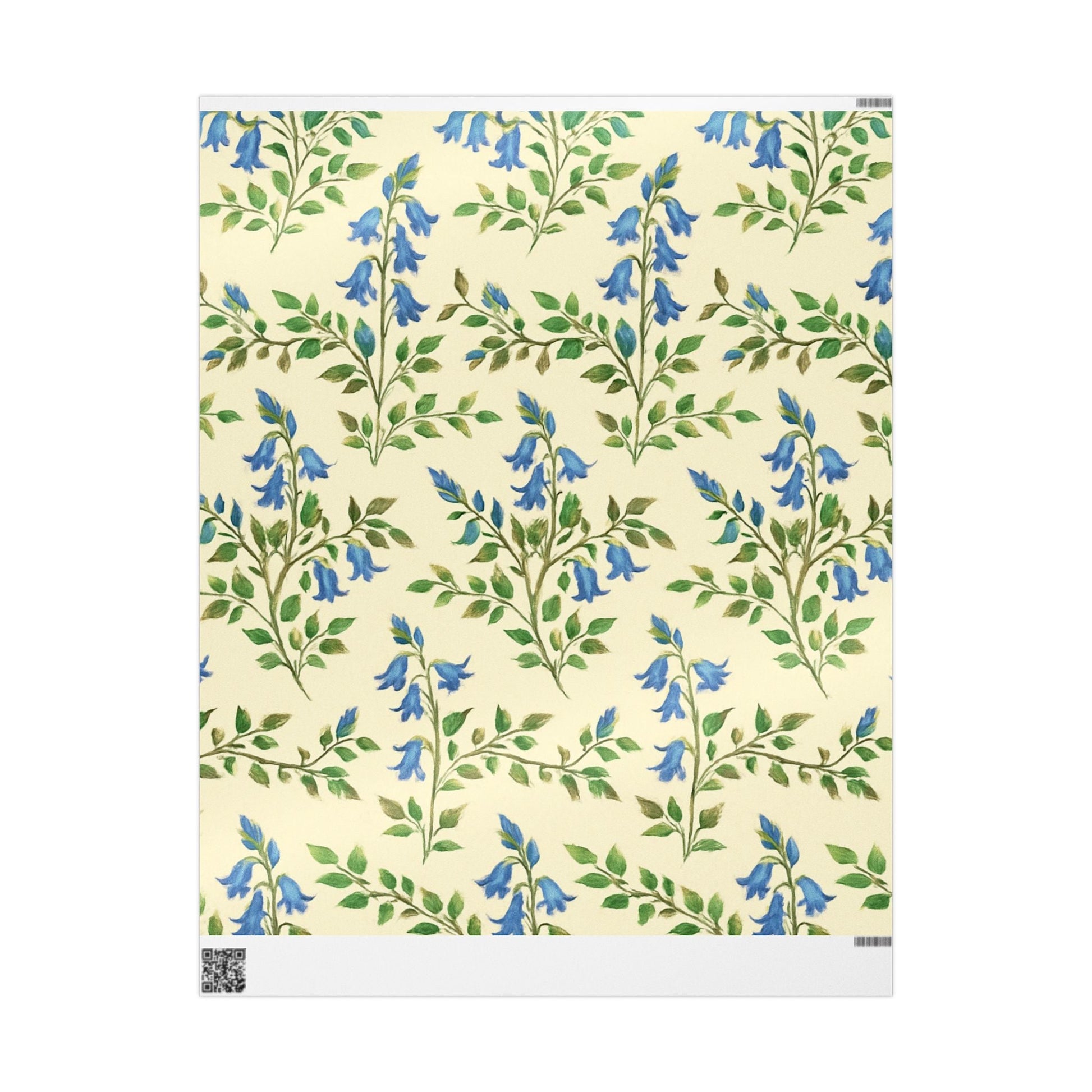 A roll of wrapping paper with a floral pattern in blue and green colors on a matte finish.