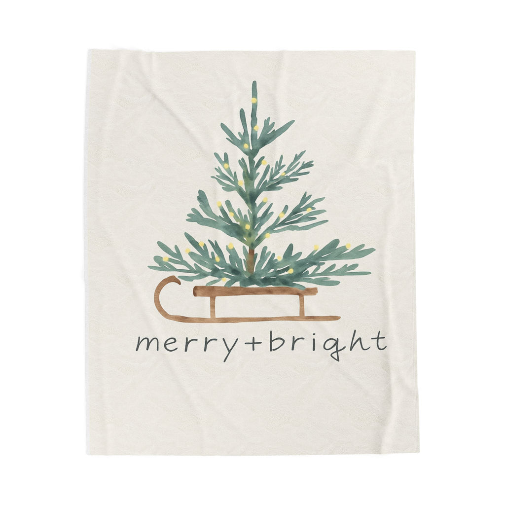 Blanket with Christmas tree and 'merry bright' text on a white background