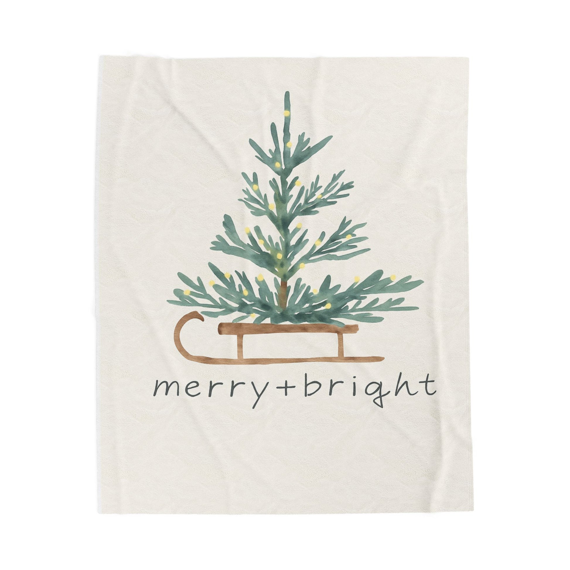 Blanket with Christmas tree and 'merry bright' text on a white background